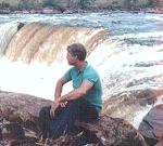 Sammy Bond sitting by Aponguao Waterfall