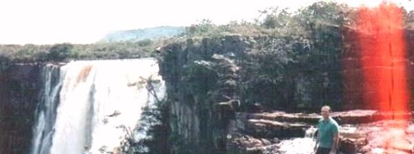 Sammy Bond standing by a Grand Sabana Waterfall